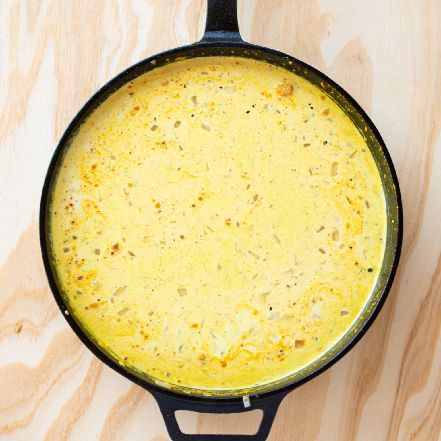 Add coconut milk and turmeric